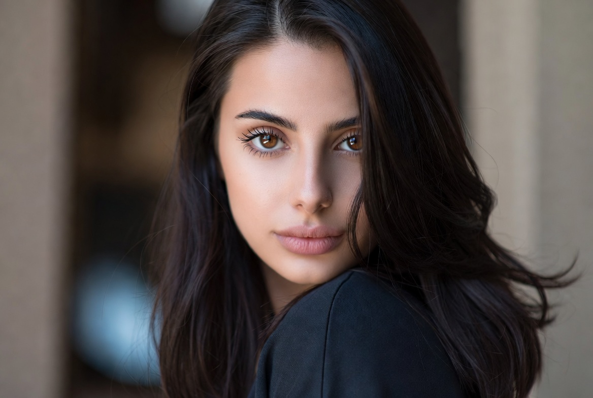 Woman examining hair thickness improvement
